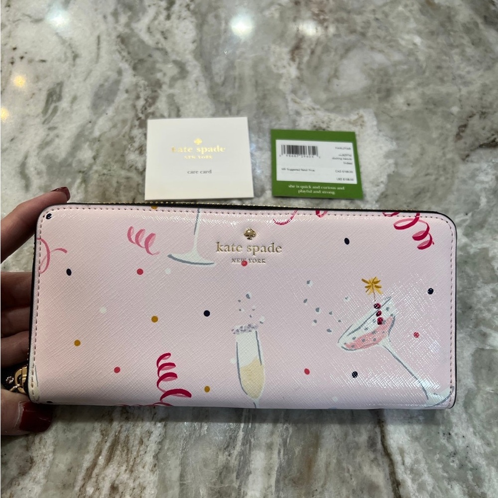 Kate Spade Pink and White Wallet . Cute champagne glass design.